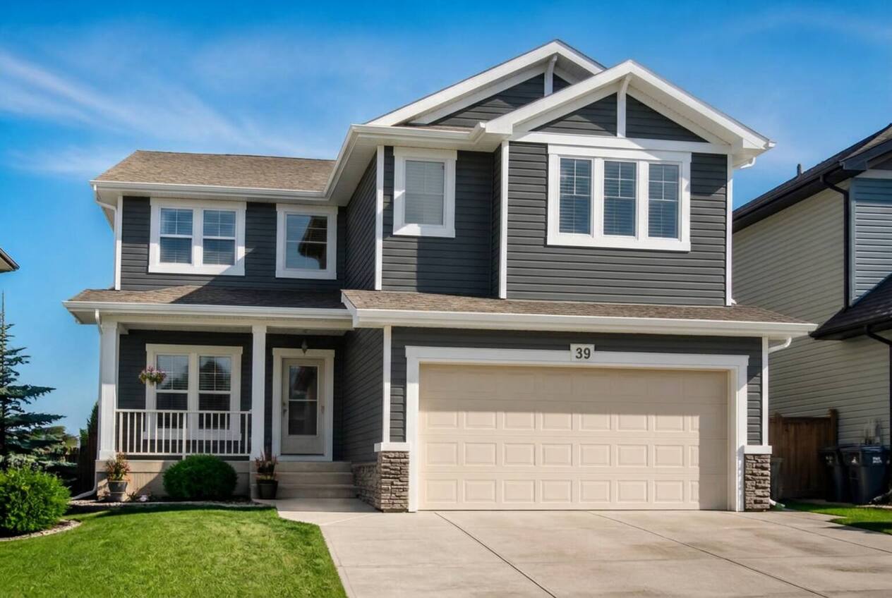 The same house with siding repainted in Night Slate