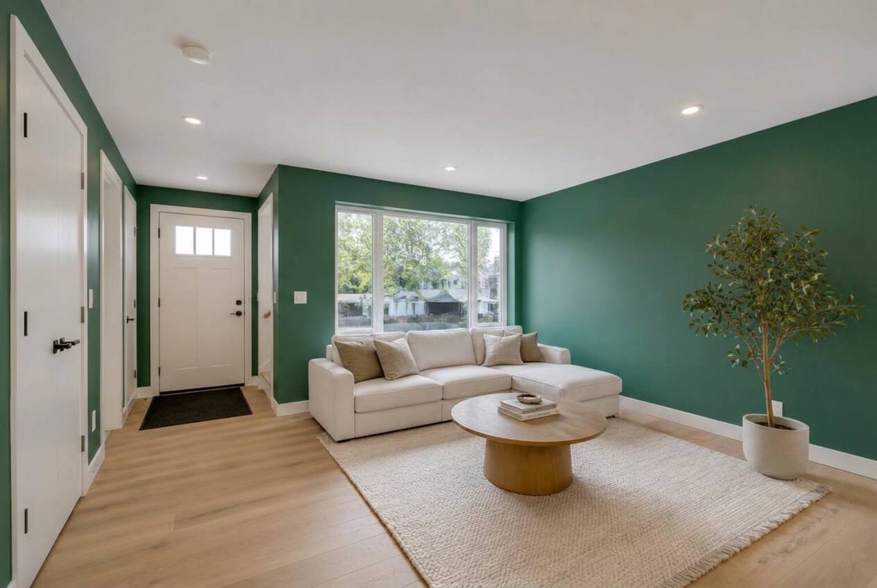 The same living room with walls repainted in Deep Juniper